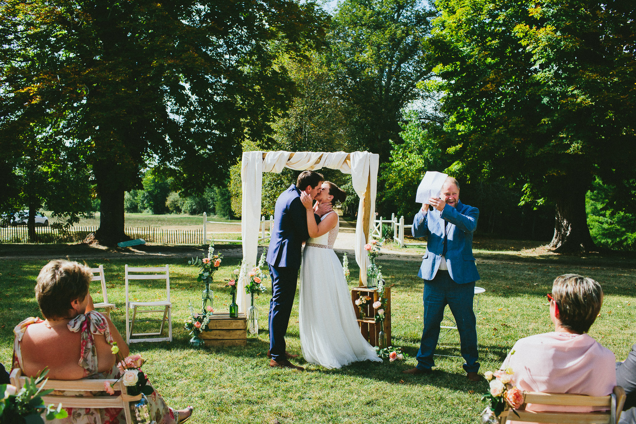 French British wedding ceremony bride groom kiss
