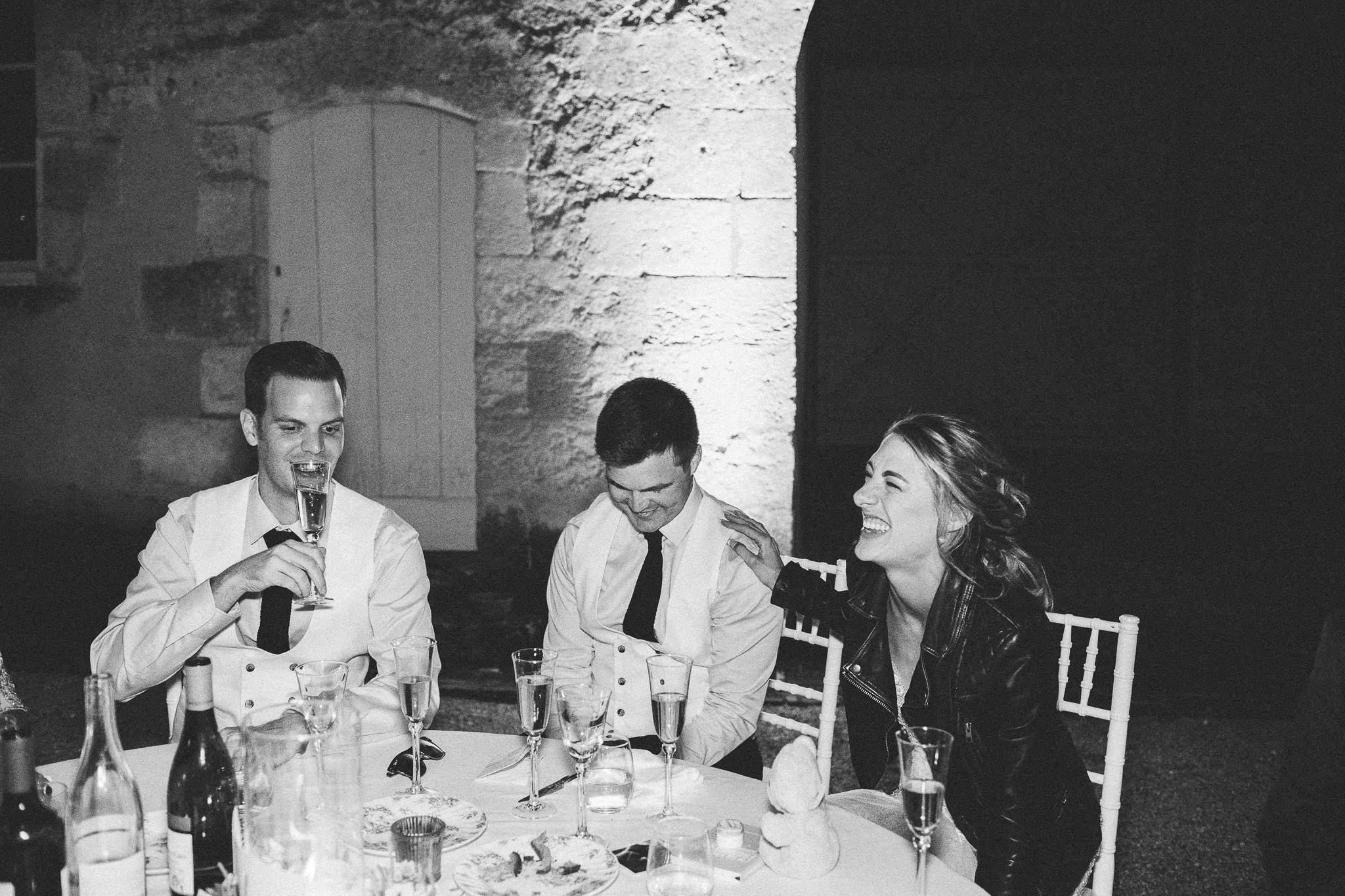 bride and groom laughing during speeches