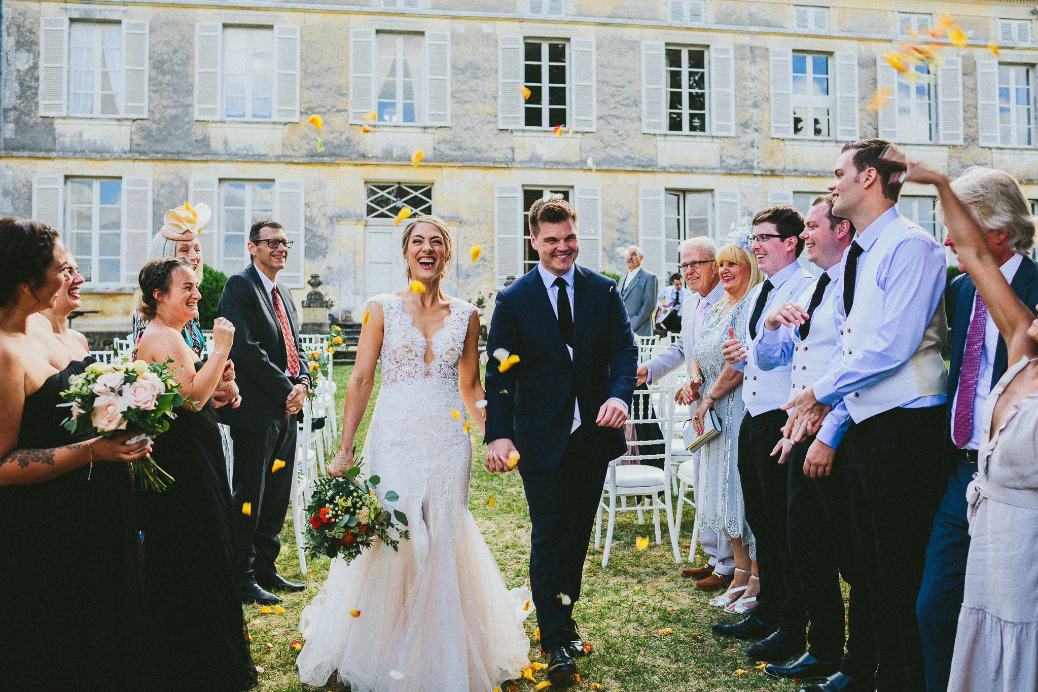 wedding ceremony walking down the aisle roses