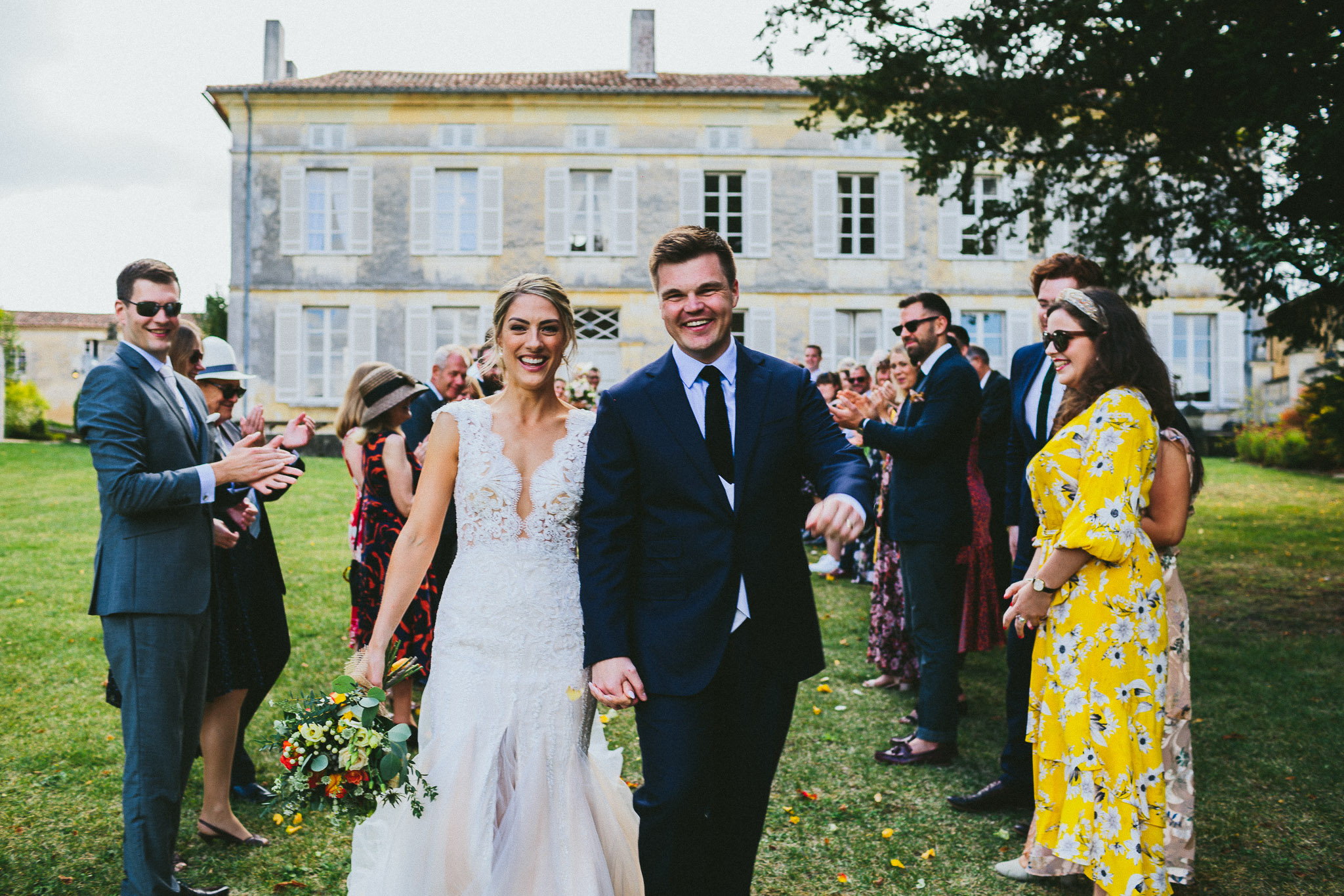 ceremony bride and groom walking down the aisle happy