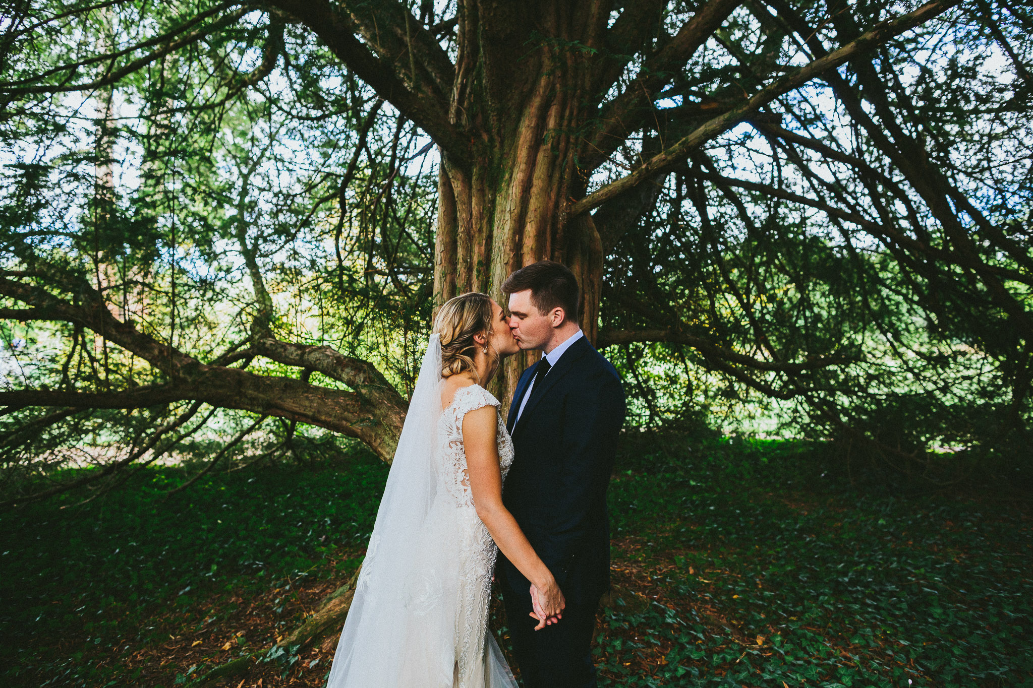 French destination wedding photo session bride and groom magnificent tree kiss