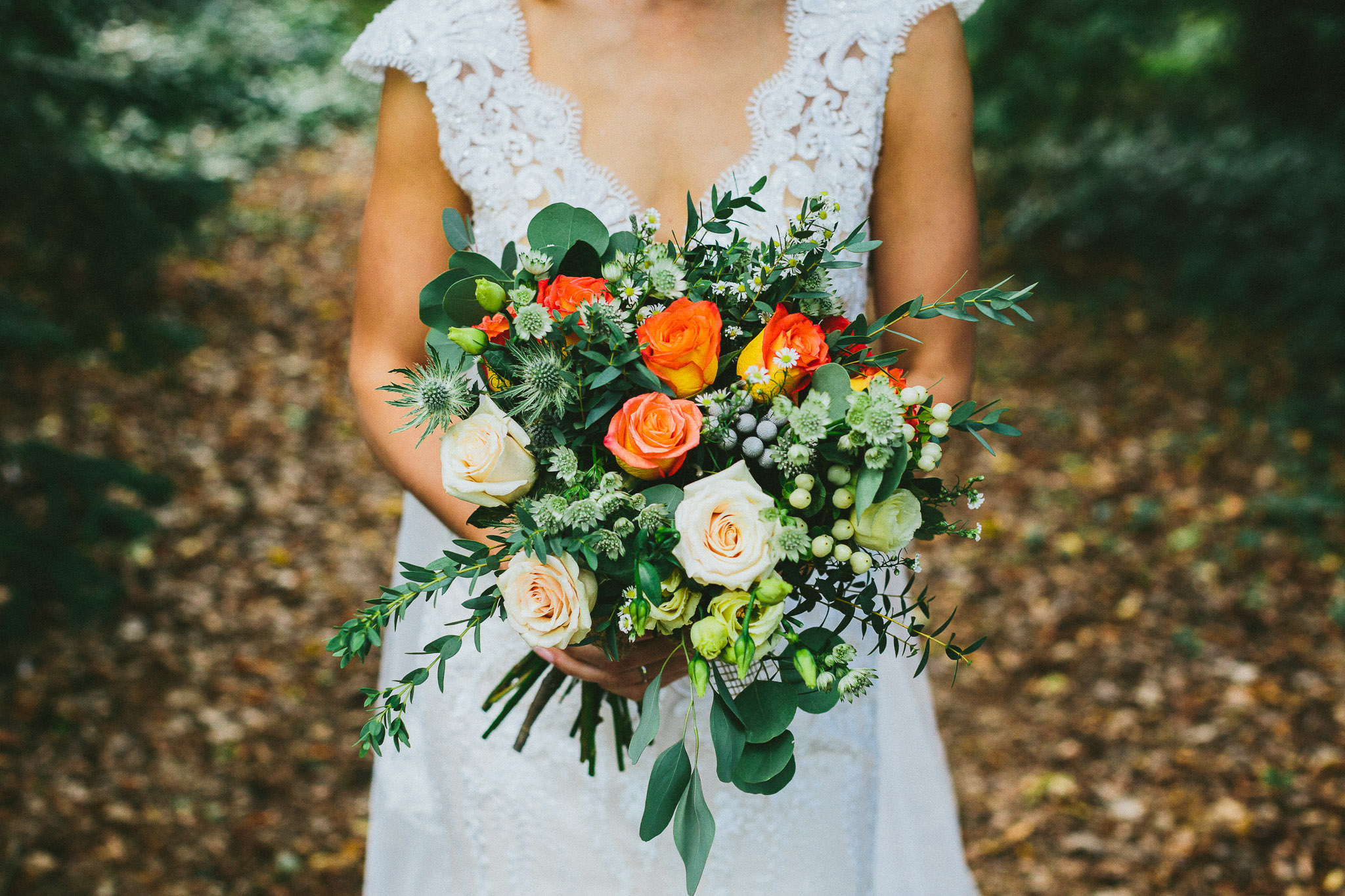 wedding photo session bride portrait in woods bouquet detail