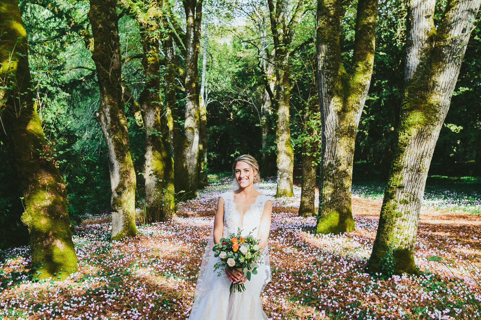 French destination wedding photo session portrait bride bed of pink flowers close up