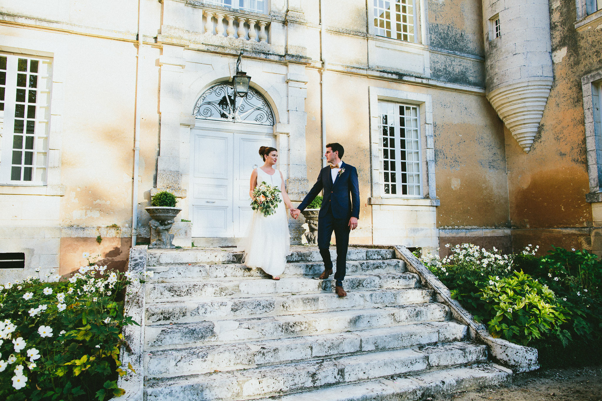 bride and groom chateau stairs