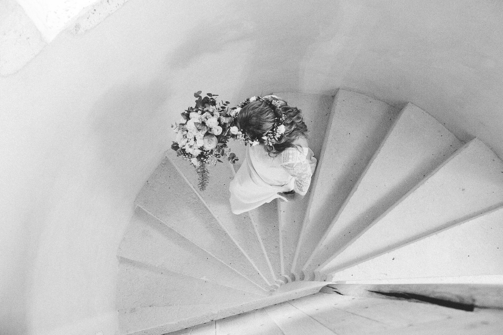 photo summary bride walking down stairs 