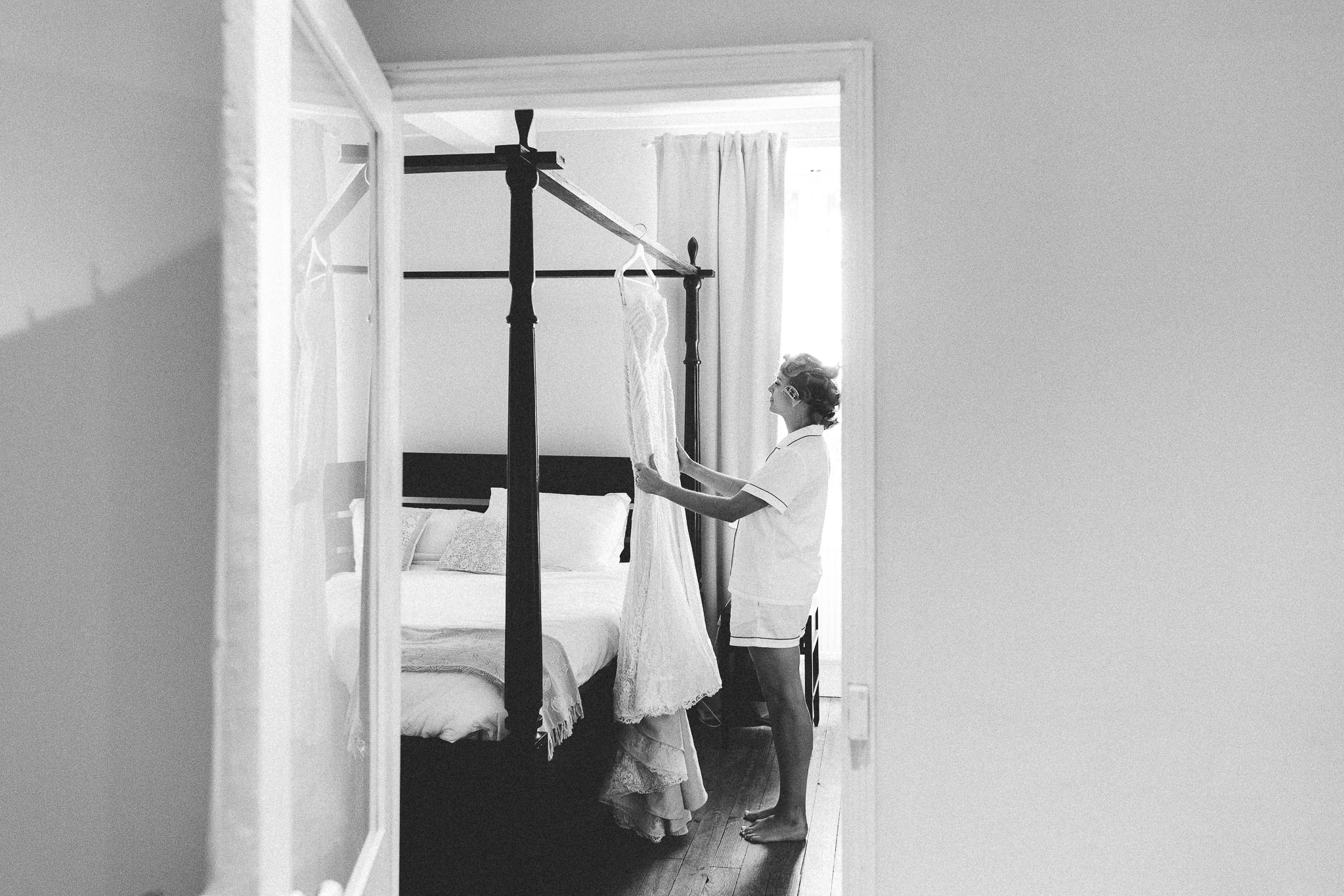 bride looking at her wedding dress