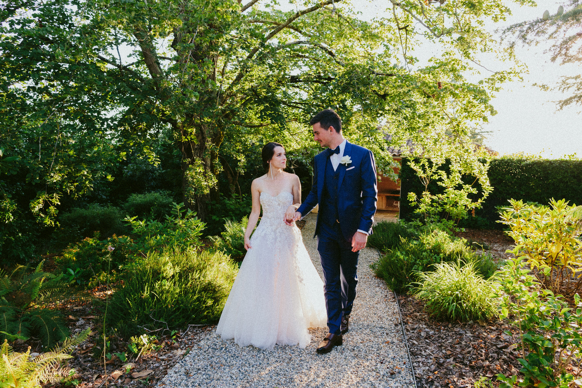 bride and groom walking amongst the trees Classy french wedding