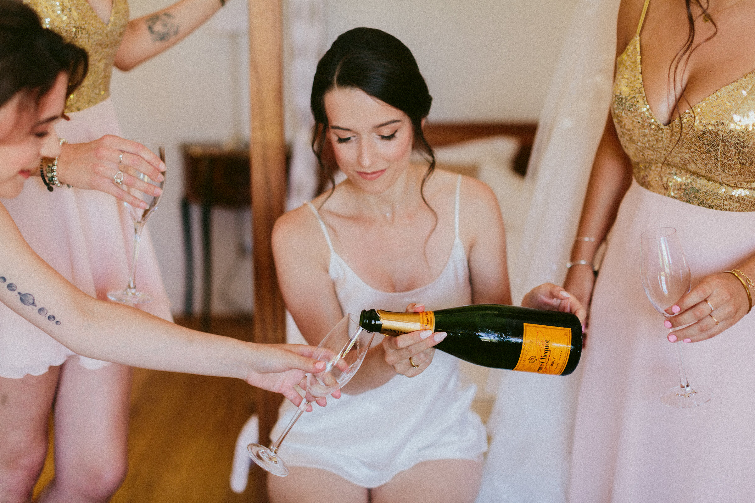 bride pouring champagne Classy french wedding