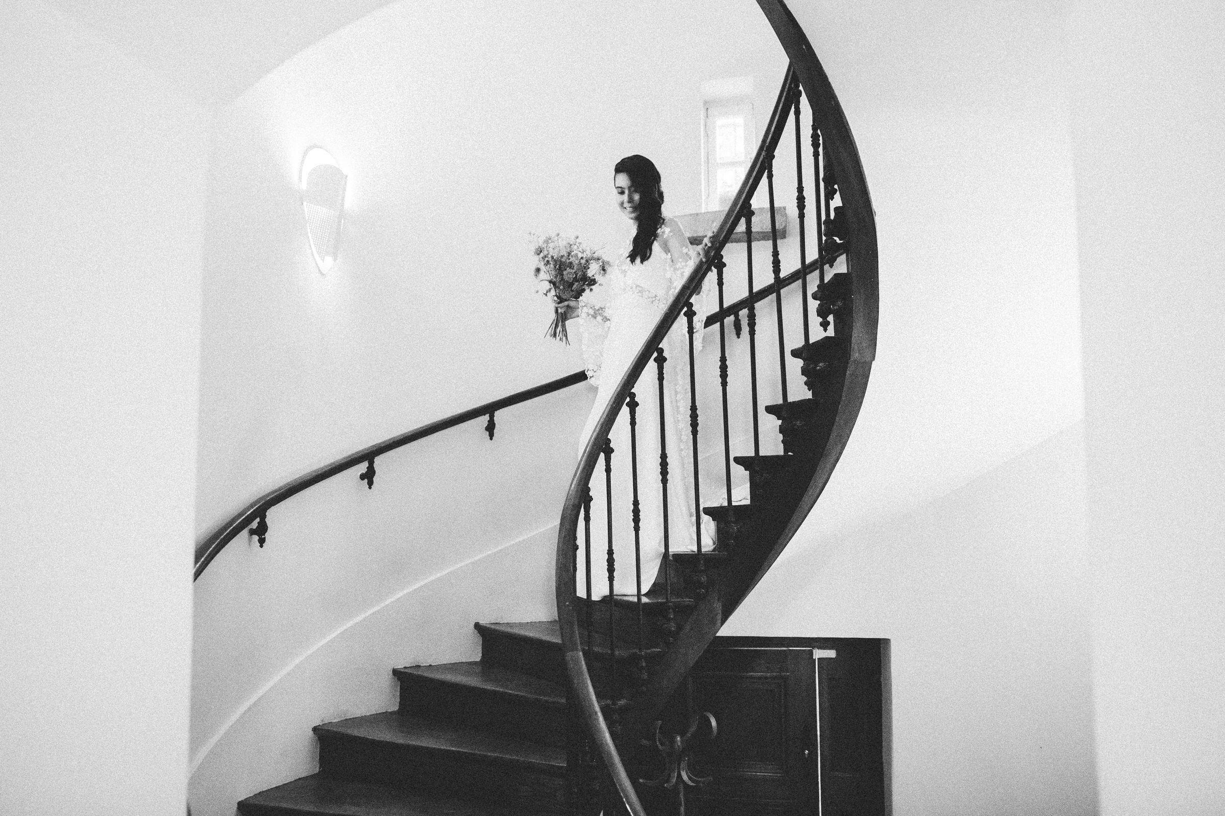 bride walking down stairs French Domain Wedding