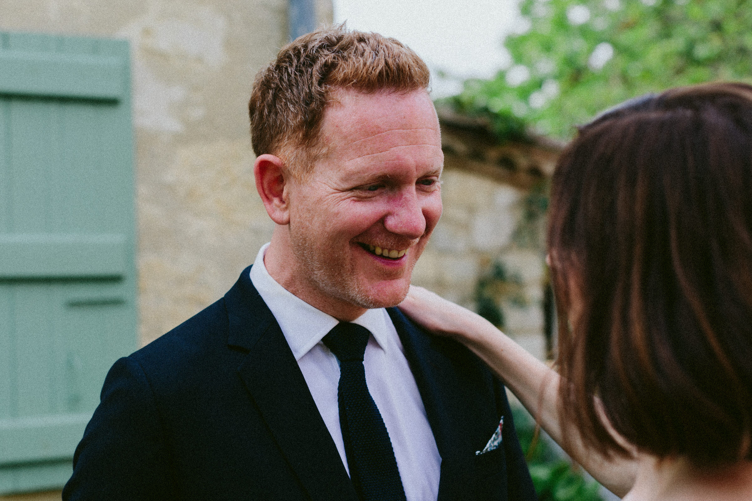 smiling groom black and white photo bride and bridesmaid Castelnau des Fieumarcon french village wedding