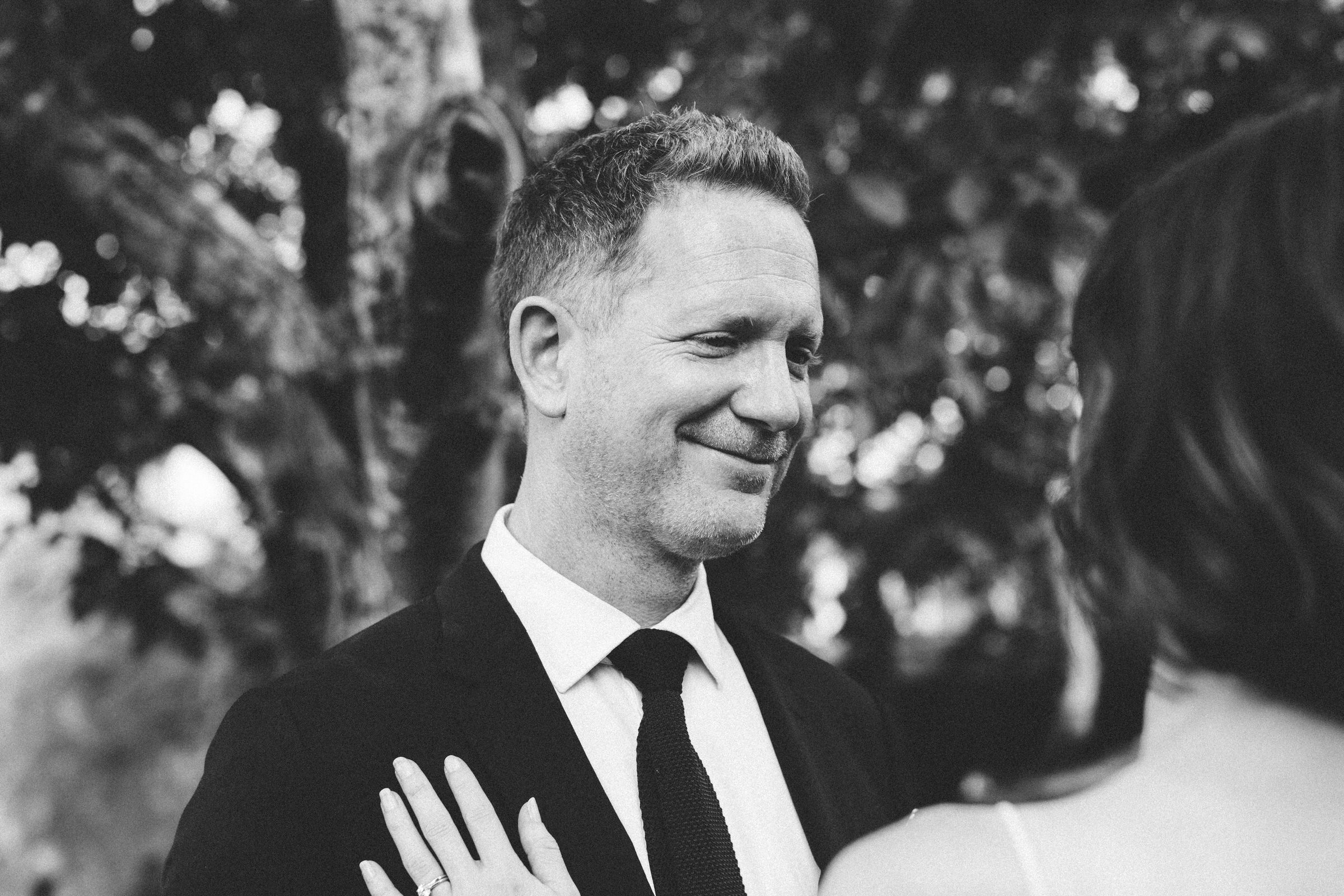handsome groom smiling Castelnau des Fieumarcon french village wedding