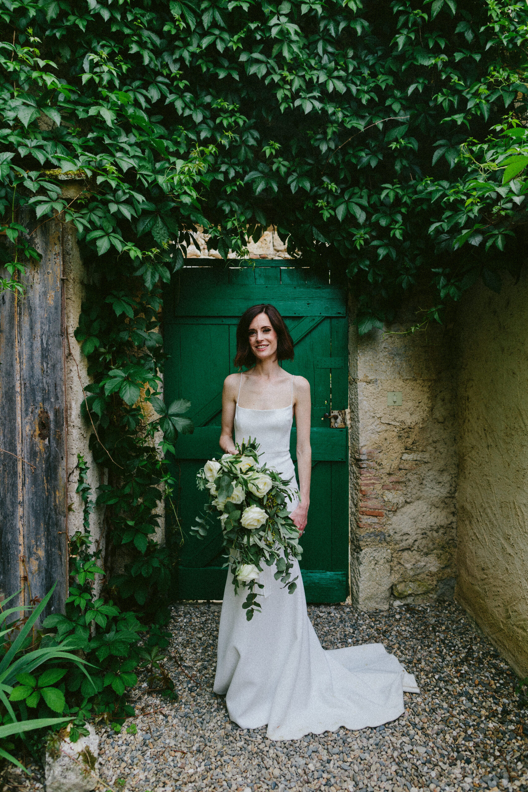 portrait of a bride green door Castelnau des Fieumarcon french village wedding
