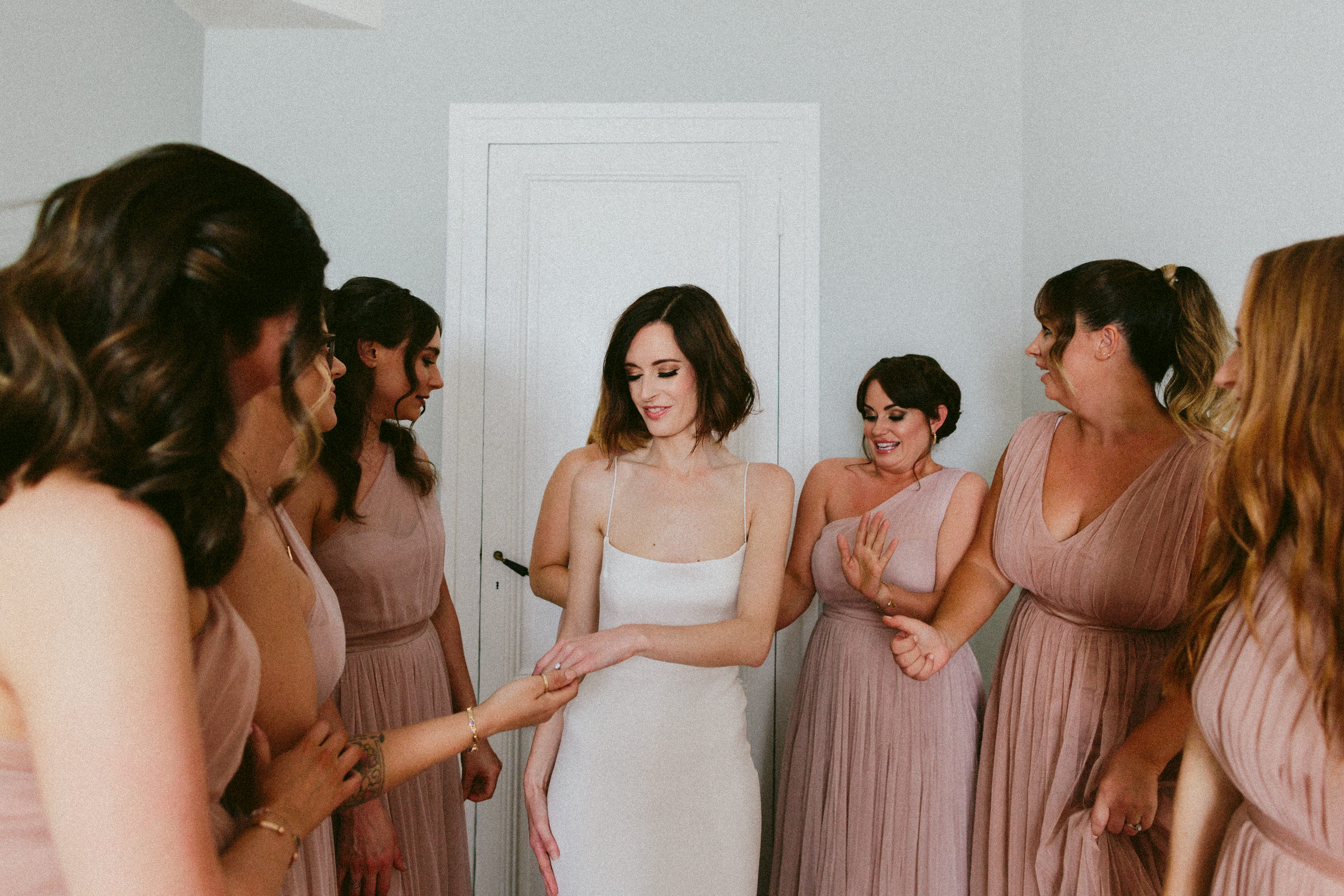 bridesmaid admiring brides engagement ring Castelnau des Fieumarcon french village wedding