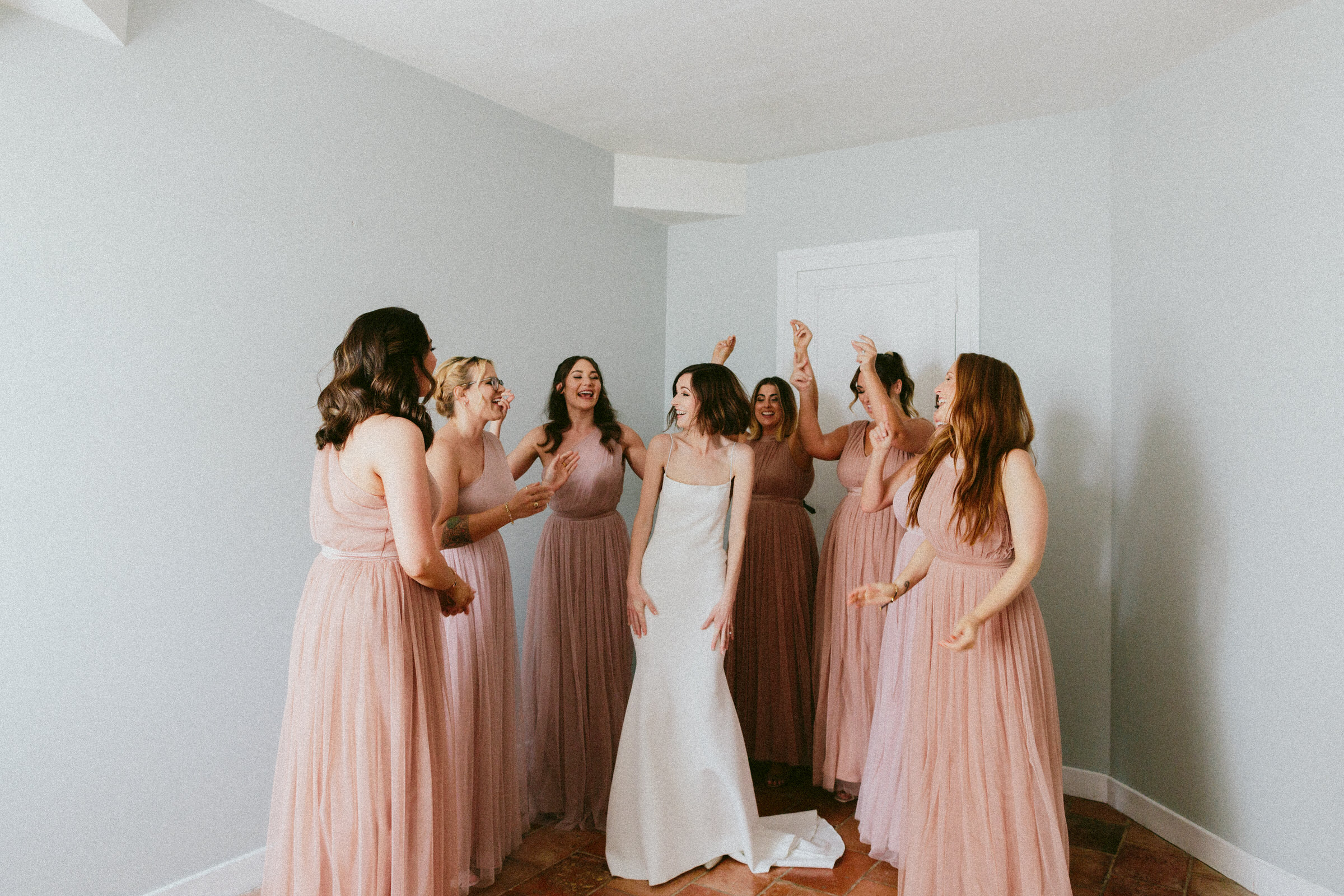 dancing happy bride with bridesmaid Castelnau des Fieumarcon french village wedding