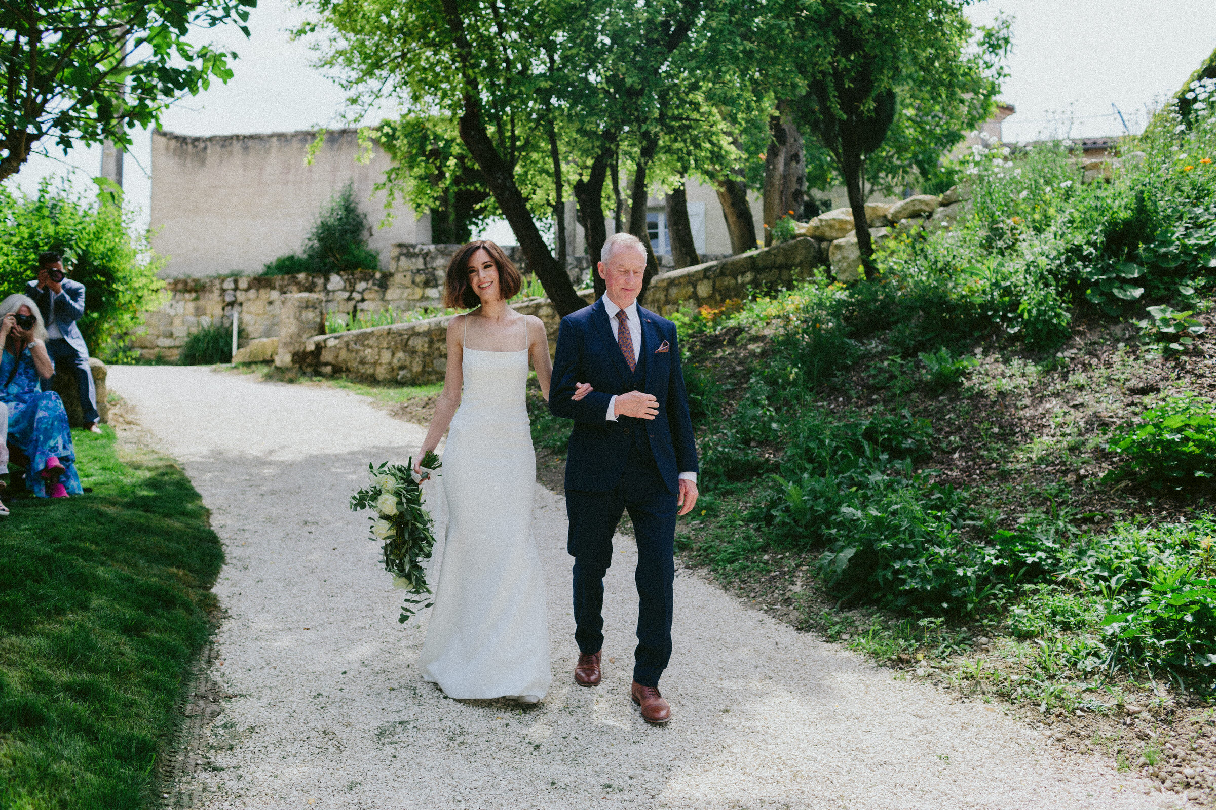wedding aisle bride and father of the bride Castelnau des Fieumarcon french village wedding